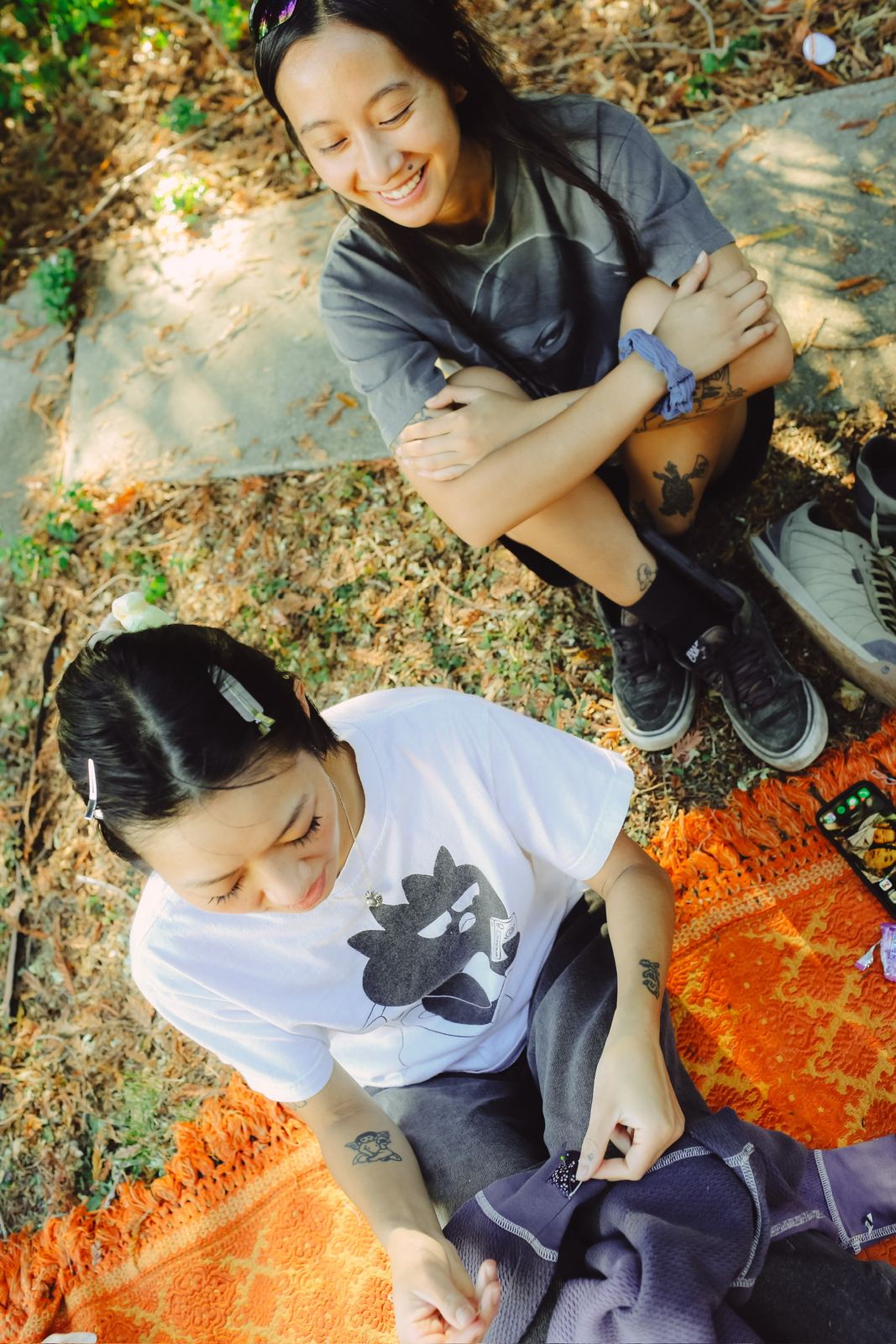 Hangs on the orange blanket